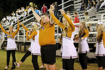Image: Zac Mercer, Madison Washington and the IHS cheerleaders keep the spirit up.