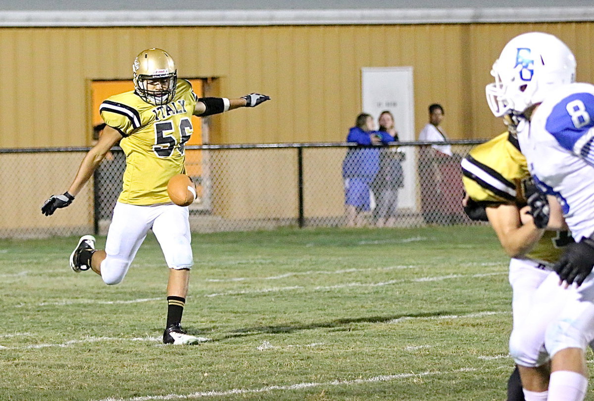 Image: David DeLaHoya(56) punts in place of teammate Levi McBride who left the game with an injury.