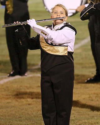 Image: Jillian Varner carries a tune while marching.