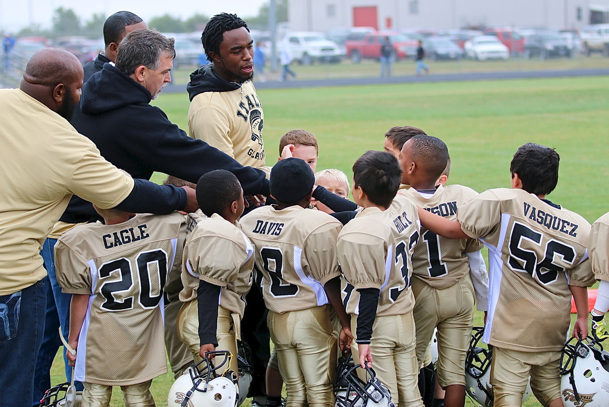 Image: C-Team head coach Jasenio Anderson and assistant coaches Gary Wood, Shedric Walker and Andre Speed congratulate their little Gladiators on their big win over Rice.