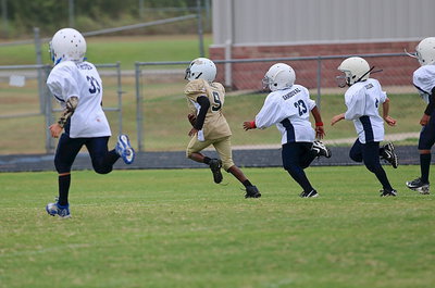 Image: B-team Gladiator John Hall, Jr.(9) outruns Bulldog tacklers on his way to his second touchdown of the game.