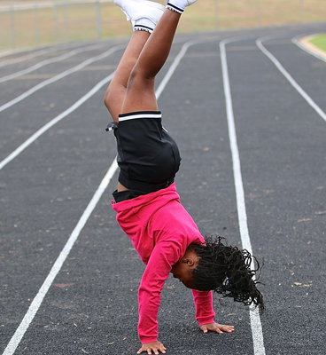 Image: IYAA cheerleader Jada Johnson displays her skills.