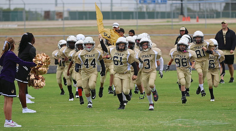 Image: The IYAA A-team Gladiators take the field against Rice to start their 2014 season.