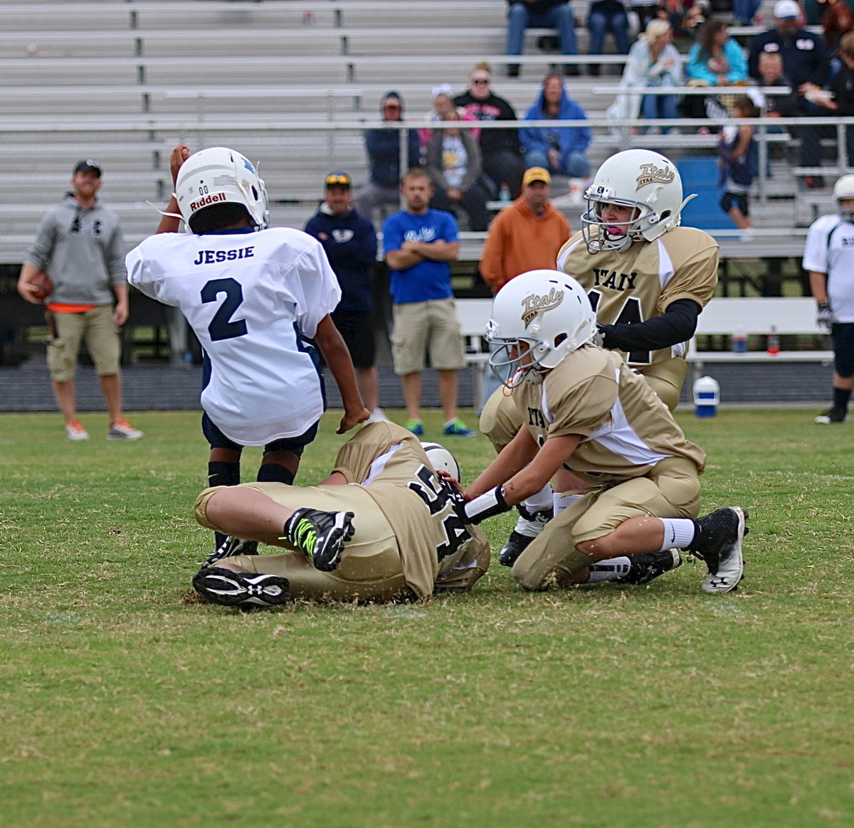 Image: Daniel Celis(94) recovers an onside kick for the A-team Gladiators to start the game against Rice.