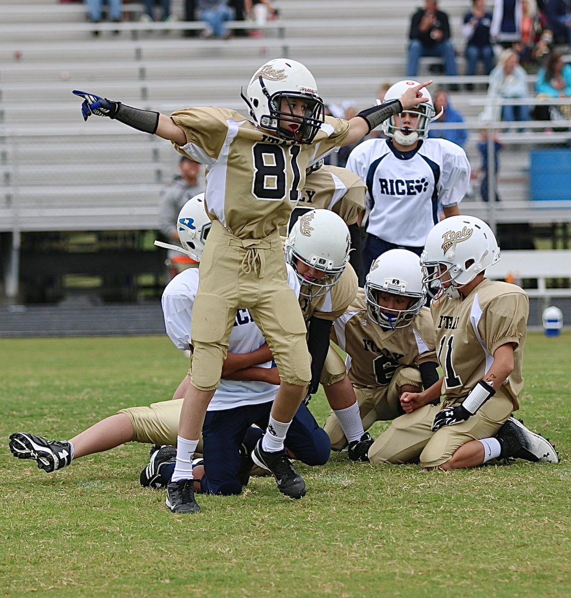 Image: Ty Beets(81) celebrates the onside kick recovery by teammate Daniel Celis.