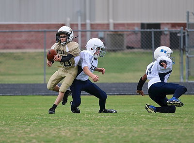 Image: A-team Gladiator Kort Holley(10) tries to get the handle on a pass from teammate Creighton Hyles(11) with Holley getting beyond the Bulldog safeties.
