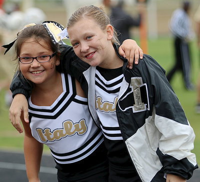 Image: IYAA A-Team Cheerleaders Renee Brewer and Karley Sigler brought their “A” games on Saturday against Rice.