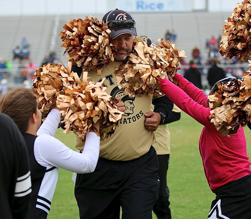 Image: B-team head coach Mark Souder is mobbed by pom-poms after his squad’s gutsy comeback effort against Rice.