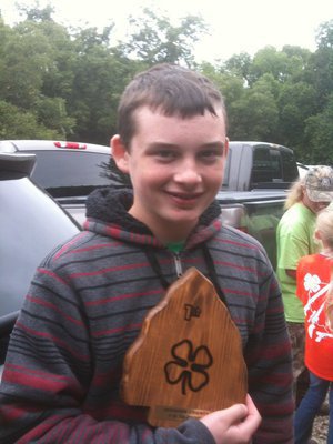 Image: Hinz and his unique trophy as the winner of the Johnson County 4-H 3D Archery Tournament.