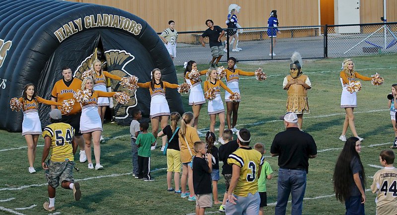 Image: Italy High School Cheerleaders get the crows fired-up before the first district game between the Gladiators and the Polar Bear of Frost.