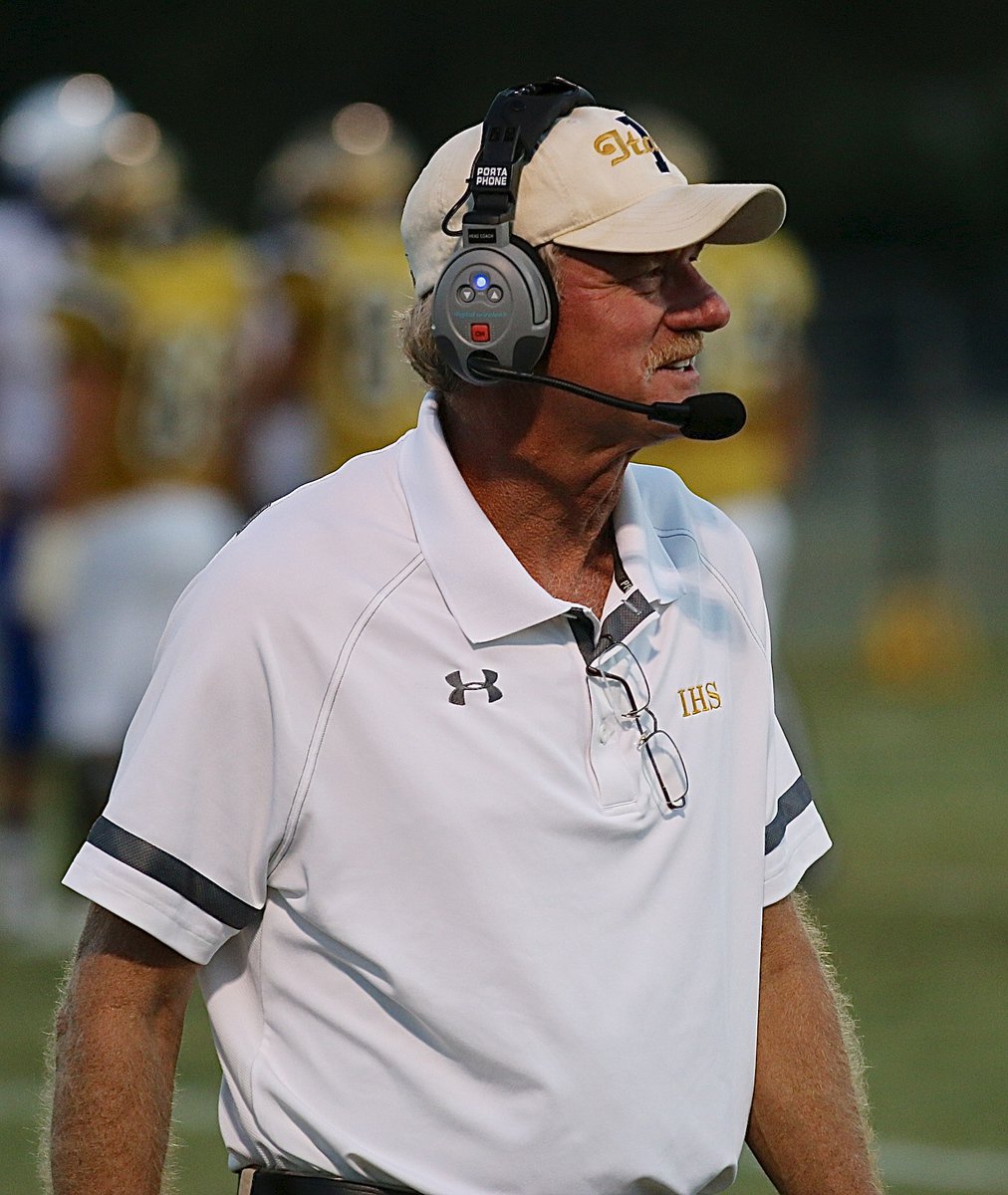 Image: Gladiator head coach Charles Tindol is feeling good about things during the coin toss.