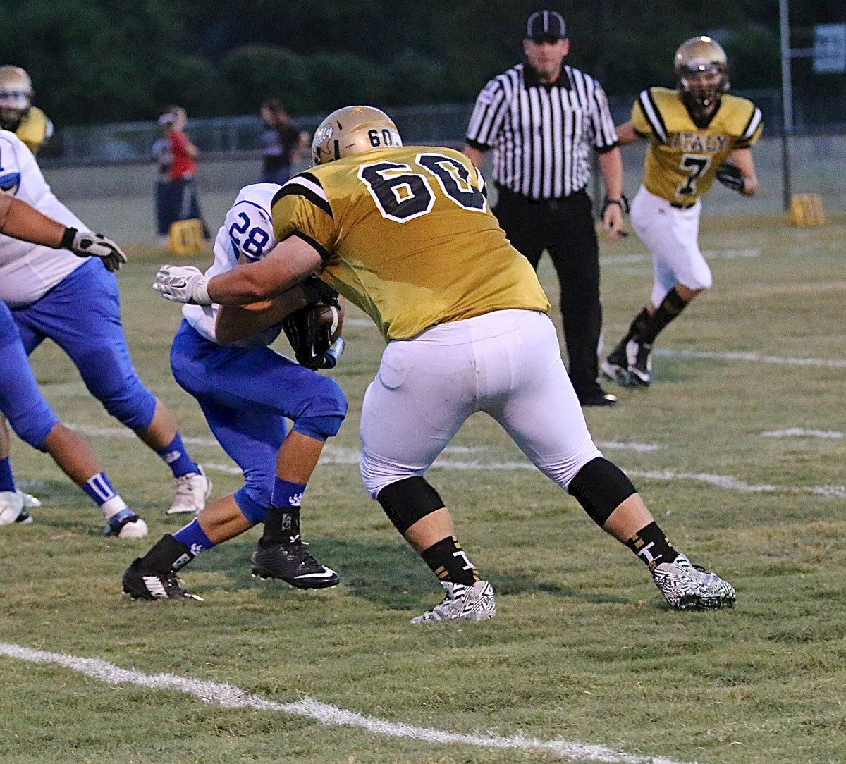 Image: Senior defensive end John Byers(60) wraps up a Polar Bear before he can do any downfield damage.