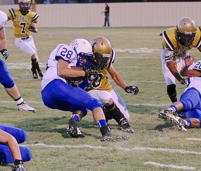 Image: Gladiator senior linebacker Coby Jeffords(10) delivers a piercing hit to a Frost running back.