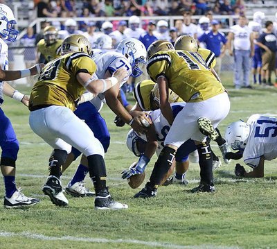 Image: Italy’s Coby Jeffords(10) and Aaron Pittmon(72) make a wish and cause a Frost runner to fumble.