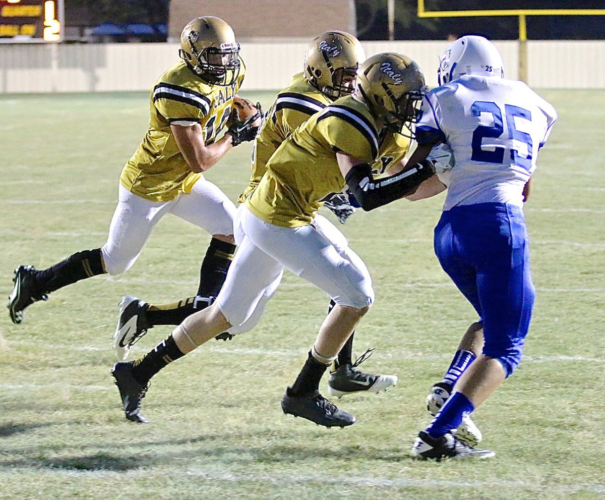 Image: Finally, on 4th and goal from the 2 yard line, Coby Jeffords(10) follows blockers Kyle Tindol(12) and Clayton Miller(6) around the left side and into the endzone for Italy’s first points of the 2014 season!