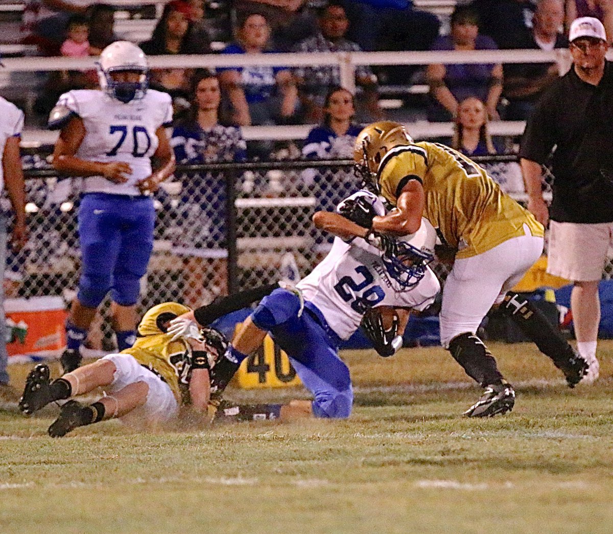 Image: Gladiators Clayton Miller(6) and Coby Jeffords(10) team up to stop a Polar Bear back.