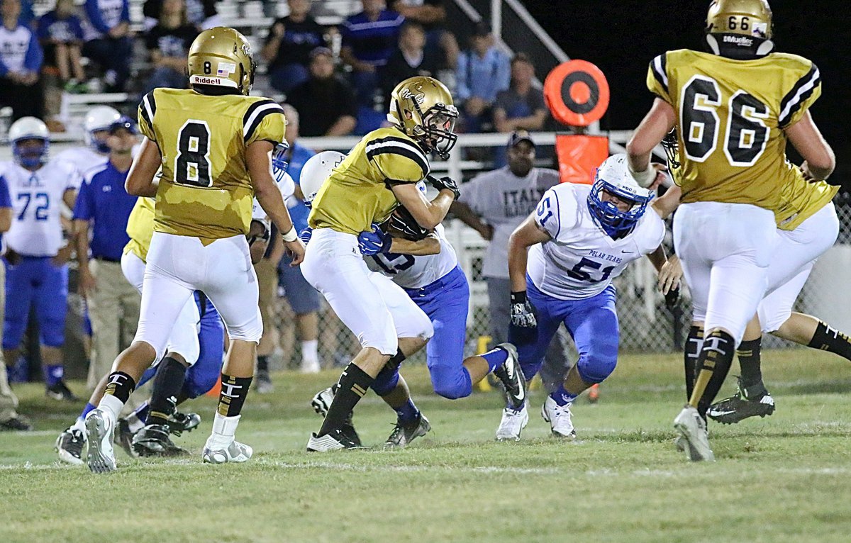 Image: Italy’s Ryan Connor(7) wiggles for extra yards thru the Frost defenses.