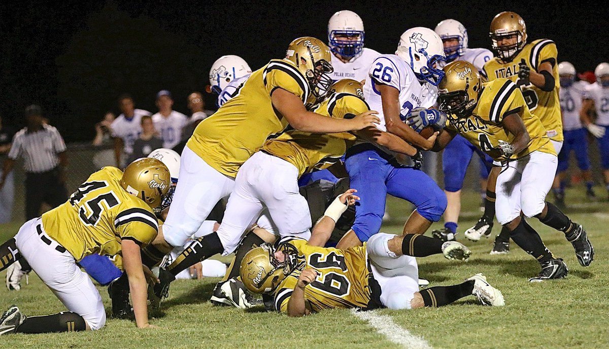 Image: No, Sir! The stubborn Gladiator defense pushes back a Frost running back with Hunter Morgan(45), Kyle Fortenberry(66), Aaron Pittmon(72), Cody Boyd(15) and Kendrick Norwood(4) bricking up the wall.