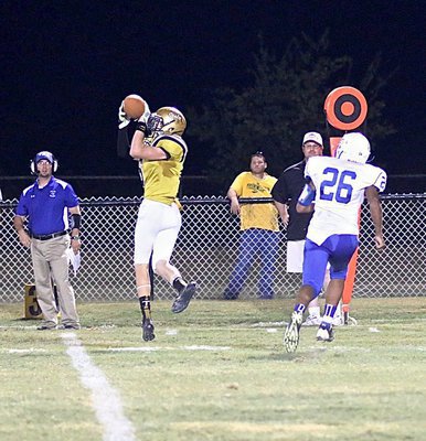 Image: Clayton Miller(6) hauls in a 17 yard pass reception for the Gladiator offense.