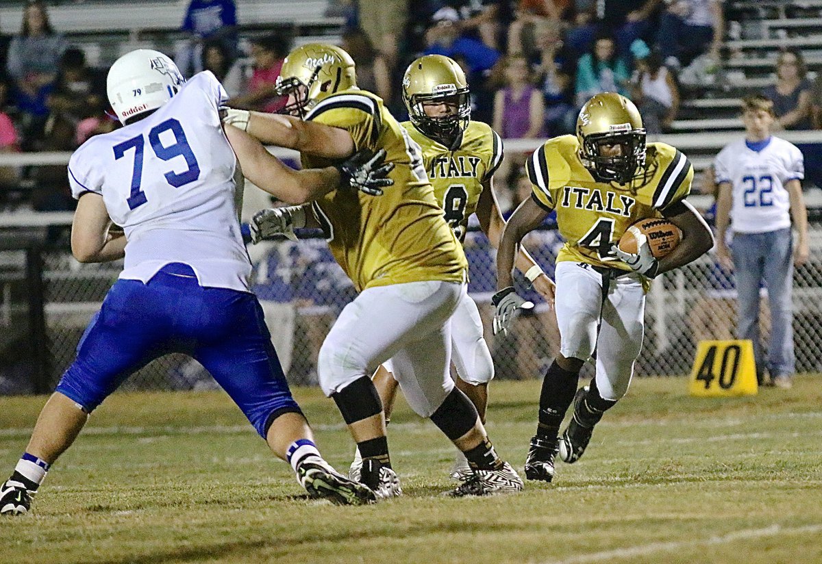 Image: Right tackle John Byers(60) creates a gap for Kendrick Norwood(4) to run thru.