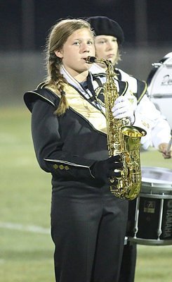 Image: Tatum Adams makes us proud while playing her sax.