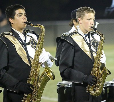 Image: Isaac Garcia and Caden Brewer performing during the Gladiator Regiment Marching Band’s halftime show.