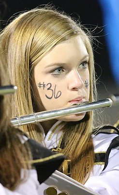 Image: Kirsten Viator eyes the rhythm as she plays her flute.