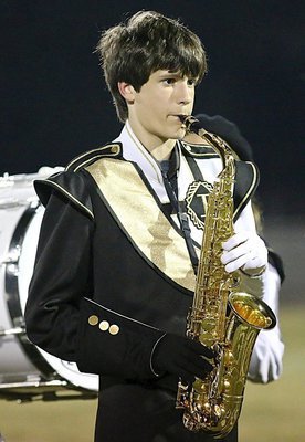 Image: Ty Hamilton handles his sax effortlessly during halftime.