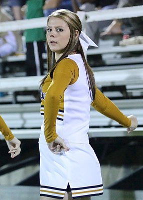 Image: Italy HS cheerleader Brooke DeBorde keeps an eye on her guys while snapping her fingers.