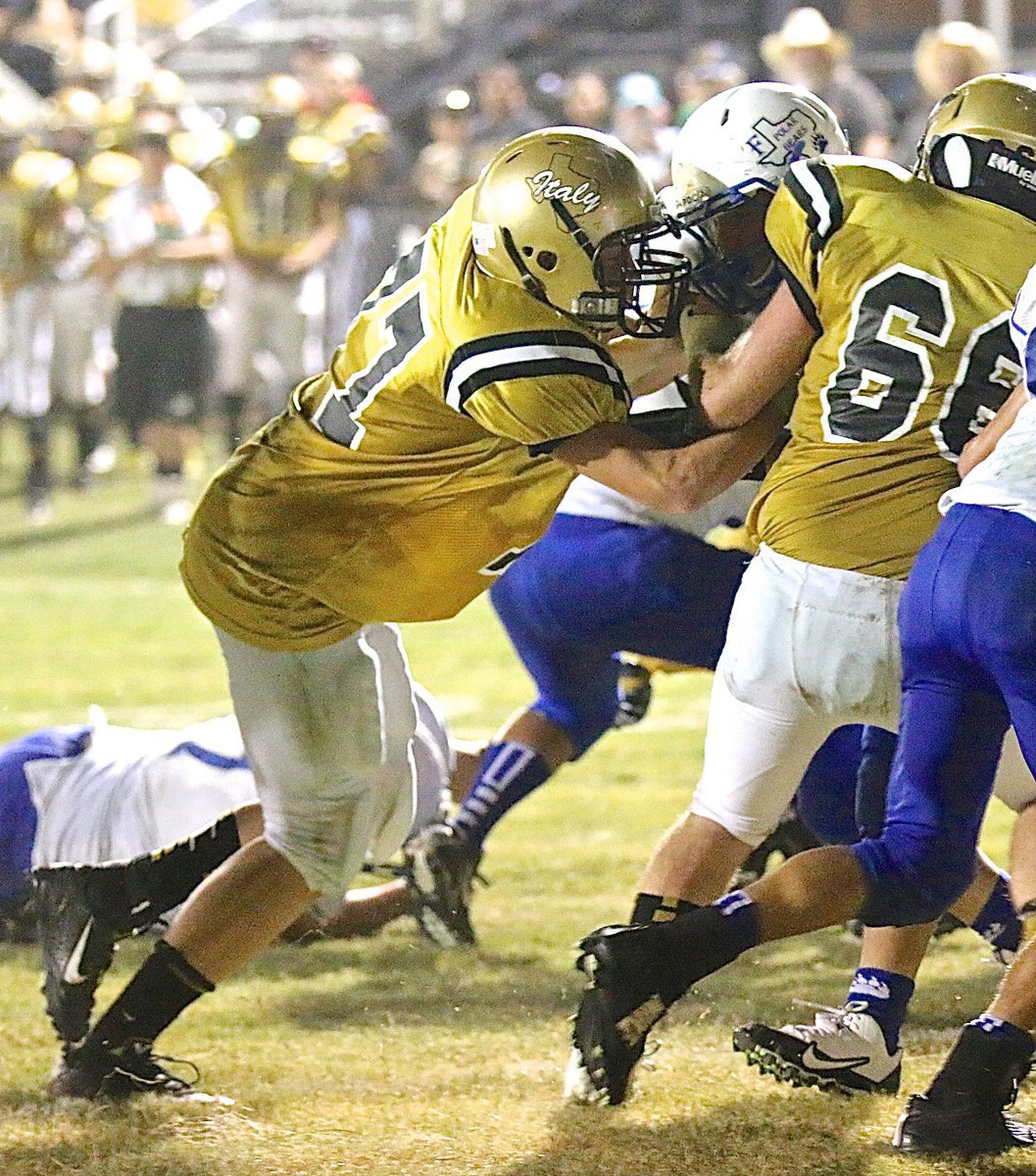 Image: Freshman guard Clay Riddle(77) earns his stripes in the trenches for the Gladiators.