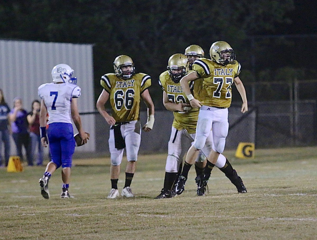 Image: Italy’s Clay Riddle(77) is pumped after sacking Frost’s quarterback for a loss.