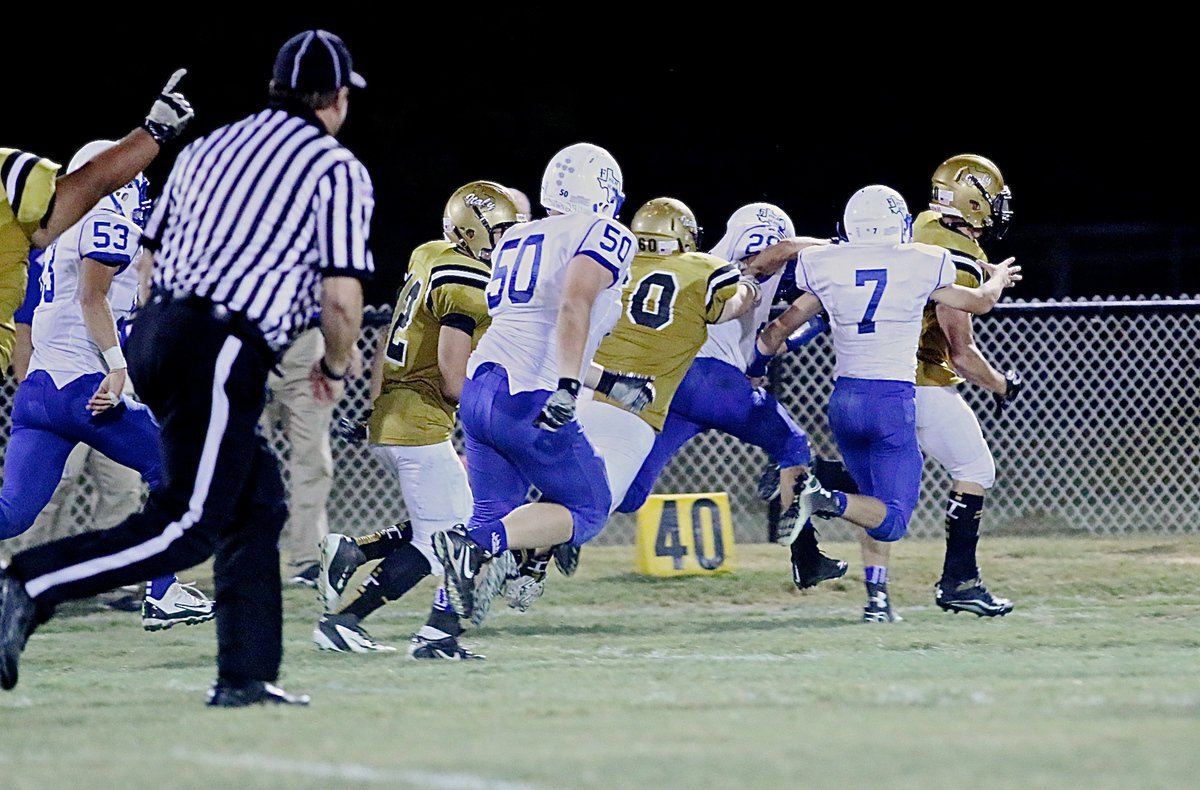 Image: One last block by backside offensive tackle John Byers(60) helps teammate Coby Jeffords(10) finish off a 63-yard touchdown run against Frost.