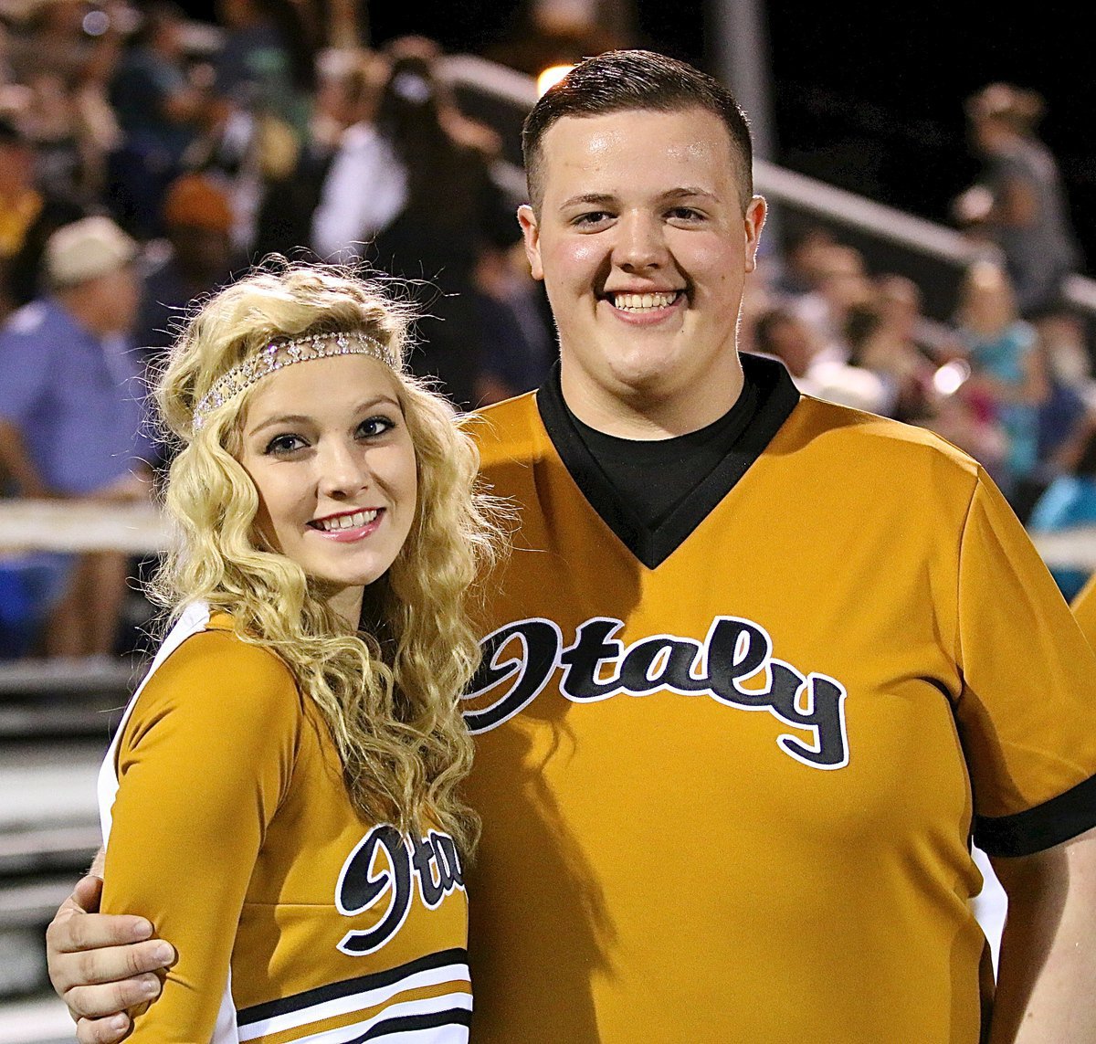 Image: Italy HS Cheerleaders Halee Turner and Zac Mercer are unable to contain their excitement with Italy leading at halftime, 14-6.