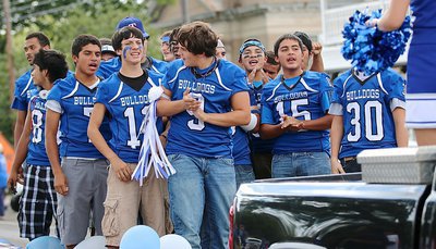 Image: Tyler Fedrick(9) and Daren Cisneros(12), both juniors, lead the cheers as the Bulldog players enjoy their homecoming experience while preparing to take on the Oakwood Panthers later in the evening.