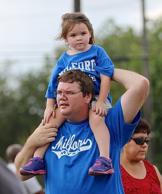 Image: Reggie Potter gives his daughter Morgan the best view in the park.