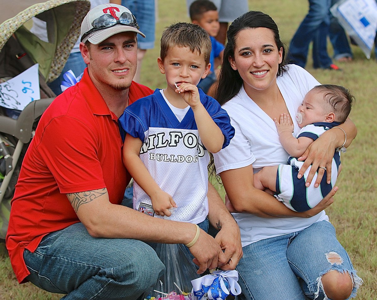 Image: Brad, Porter, Kasey and Parker Montgomery are enjoying the pep rally in the park.