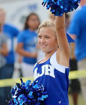 Image: Abby Evans cheers on her Bulldogs during the pep rally in the park.