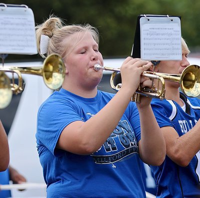 Image: Kalli Griffin and the Milford High School band members give it their all for the Bulldogs!