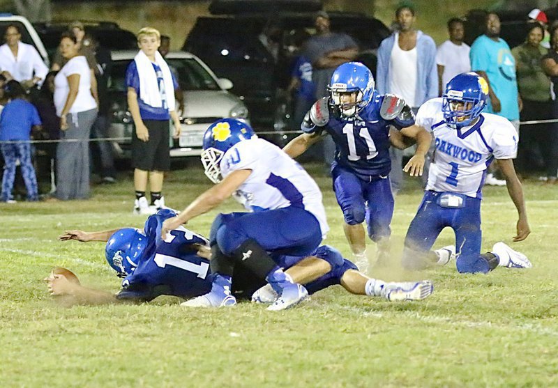 Image: Bulldog defender Keith Kayser(13) has a chance to recover the Oakwood fumble.