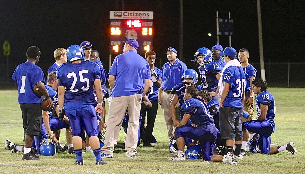 Image: Head Coach Ronnie Crumpton talks to his Bulldogs late in the fourth.