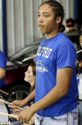 Image: Devonteh Williams supports his Bulldogs via the drums during homecoming.