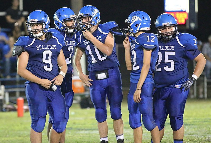 Image: Tyler Fedrick(9), TraVion Jones(2), Cole Falzerano(10), Daren Cisneros(12) and Juan Venegas(25) await the play call from the sideline.