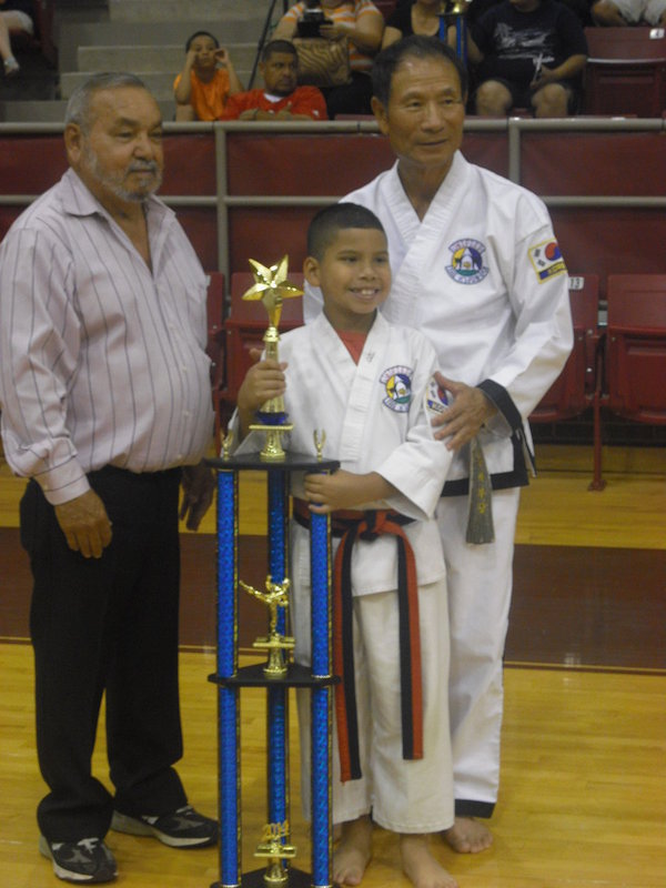 Image: Pictured is Master Charles Kight, chief instructor of the Hillsboro TKD school, Nick and Grand Master Park co-founder of Unified TKD.