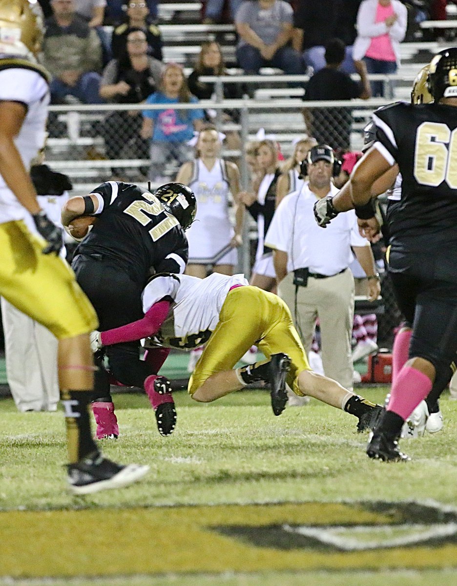 Image: Clayton Miller(6) makes a form tackle for Italy’s defense.