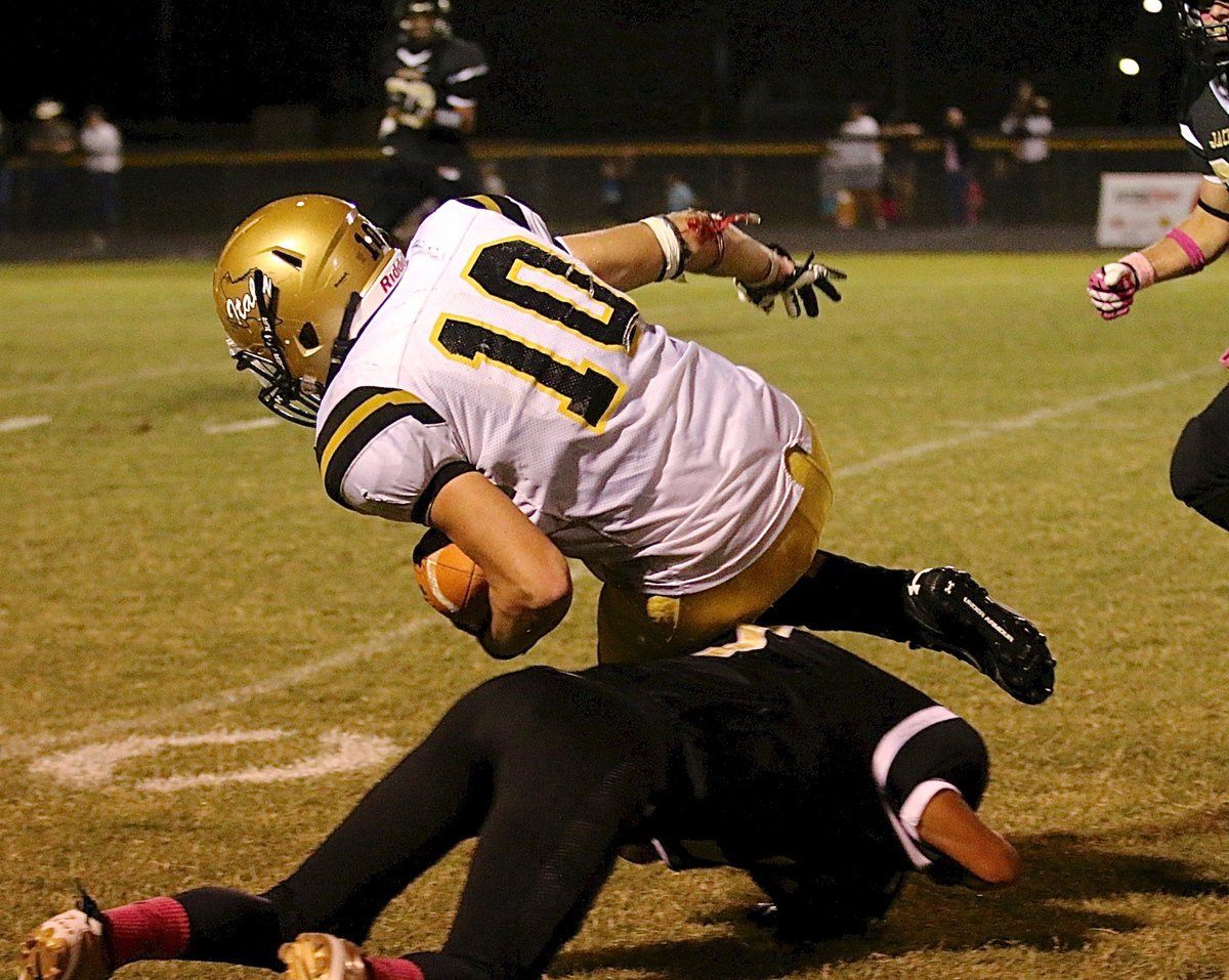 Image: Coby Jeffords(10) is finally tripped up after a 21 yard pass completion.