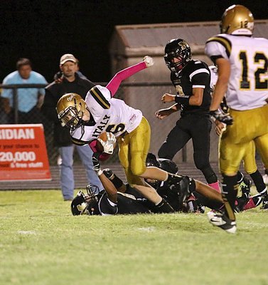 Image: Clayton Miller(6) powers his way for a big play in the Gladiator passing game.