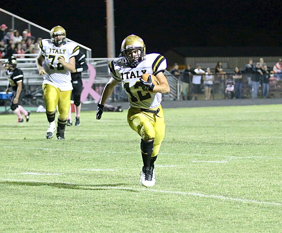 Image: Kyle Tindol(12) breaks tackles after a catch and then hurries 18-yards for a Gladiator touchdown.