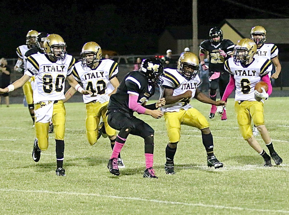 Image: Jack Hernandez(80), Dylan McCasland(40) and Kendrick Norwood(4) clear the way for Clayton Miller(6) who returns the kickoff deep into Yellowjacket territory late in the fourth-quarter.