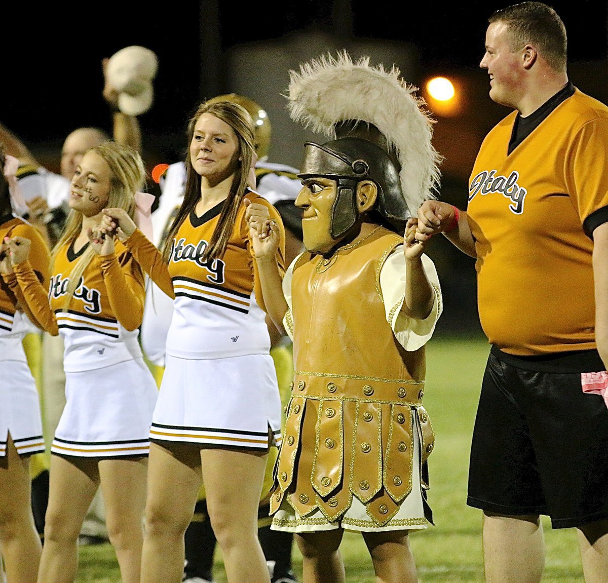 Image: The school spirit of Britney Chambers, Brooke DeBorde, Gladiator mascot Noeli Garcia and Zac Mercer shines thru the tough times and the good times.