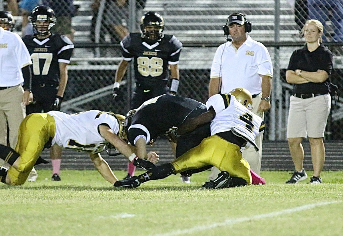 Image: Gladiators Kendrick Norwood(4) and Coby Jeffords(10) team up to make the stop on the opening kickoff.